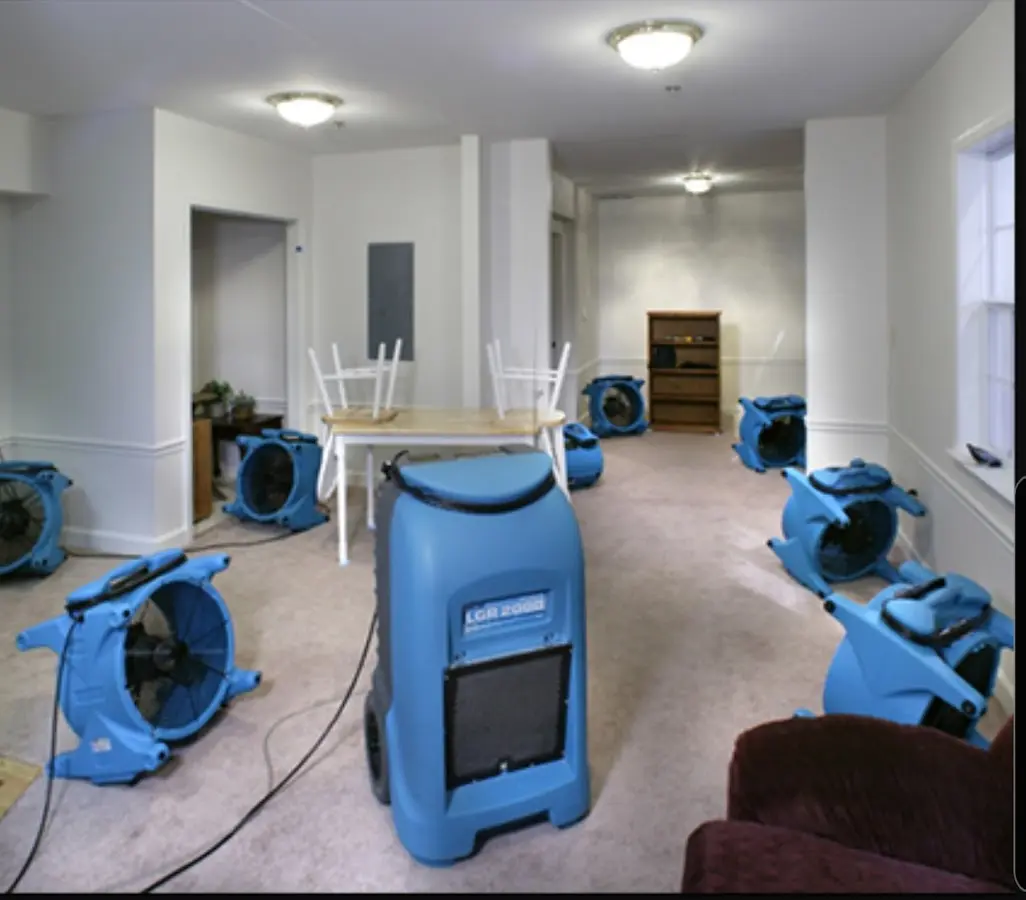 Air movers and dehumidifier setup for Water Damage Restoration in Taylor